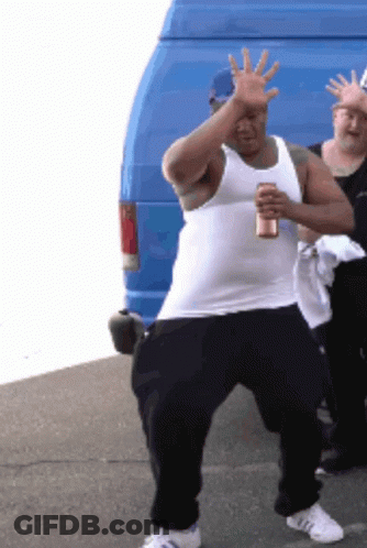 A Man In A White Tank Top Is Holding A Can Of Beer GIF