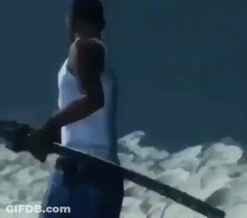 A Man In A White Tank Top Is Holding A Sword In His Hand GIF