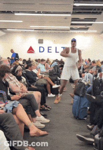 A Man In A White Tank Top Is Running In Front Of A Delta Sign GIF