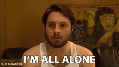 A Man In A White Tank Top Is Saying I 'M All Alone GIF