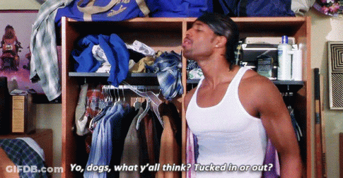 A Man In A White Tank Top Is Standing In Front Of A Closet And Says Yo Dogs GIF