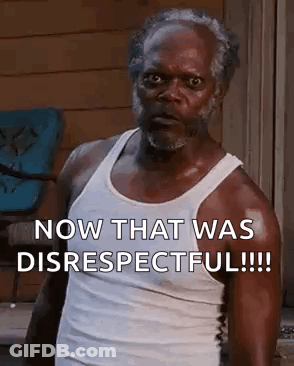 A Man In A White Tank Top Is Standing In Front Of A Window And Says `` Now That Was Disrespectful '' . GIF