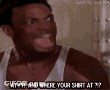 A Man In A White Tank Top Is Sticking His Tongue Out And Asking Where His Shirt At . GIF