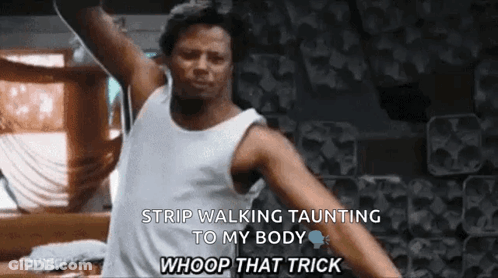 A Man In A White Tank Top Is Strip Walking Taunting To His Body . GIF