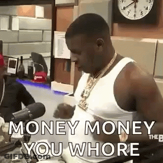 A Man In A White Tank Top Is Talking Into A Microphone In Front Of A Clock And A Clock . GIF