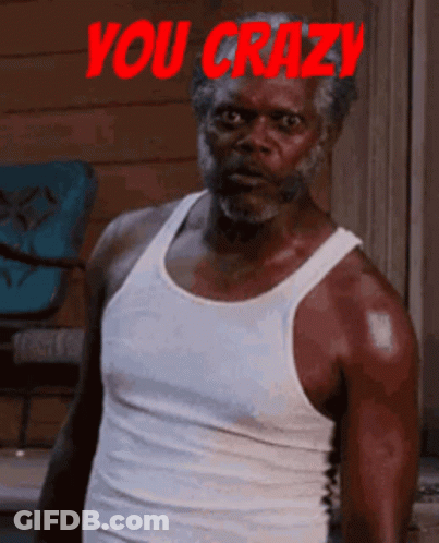 A Man In A White Tank Top Says You Crazy In Red GIF