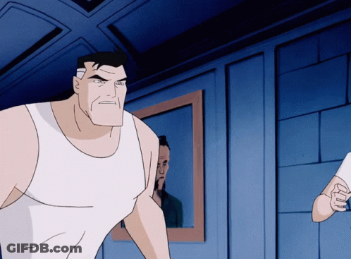 A Man In A White Tank Top Stands In Front Of A Mirror GIF
