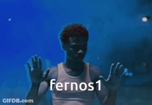 A Man In A White Tank Top With Fernos1 Written On The Bottom GIF