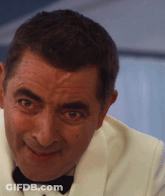 A Man In A White Tuxedo And Black Bow Tie GIF