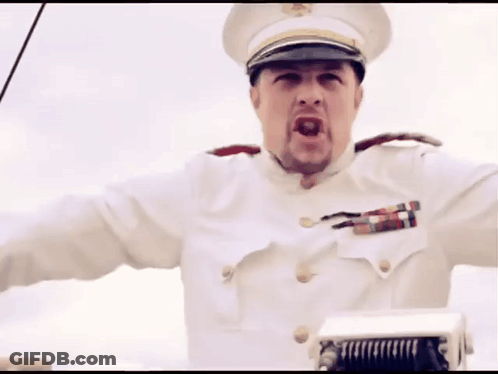 A Man In A White Uniform With A Hat And A Badge On His Chest GIF