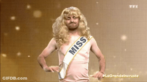 A Man In A Wig And Sash That Says Miss GIF