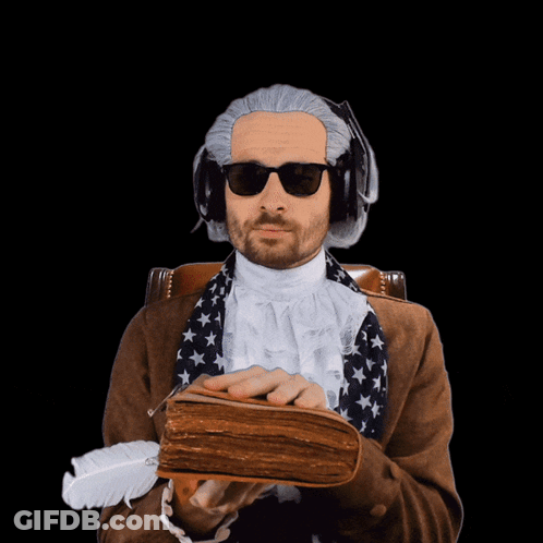 A Man In A Wig And Sunglasses Is Holding A Book GIF