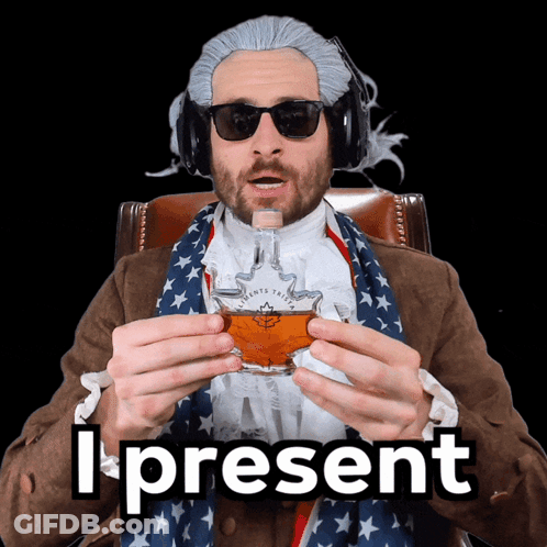 A Man In A Wig And Sunglasses Is Holding A Glass Of Maple Syrup And The Words I Present Behind Him GIF