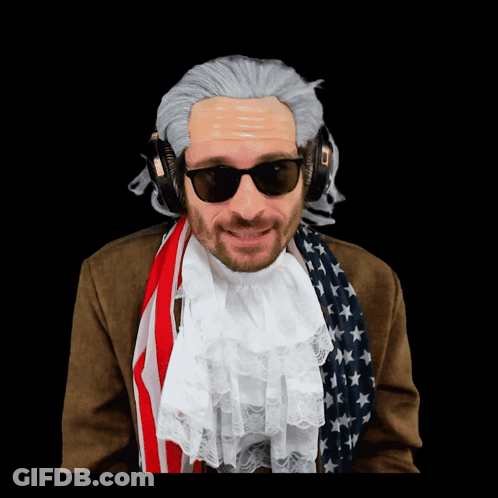 A Man In A Wig And Sunglasses Is Wearing Headphones And An American Flag Scarf GIF