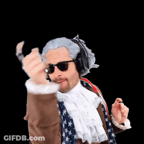 A Man In A Wig And Sunglasses Is Wearing Headphones And An American Flag Scarf GIF