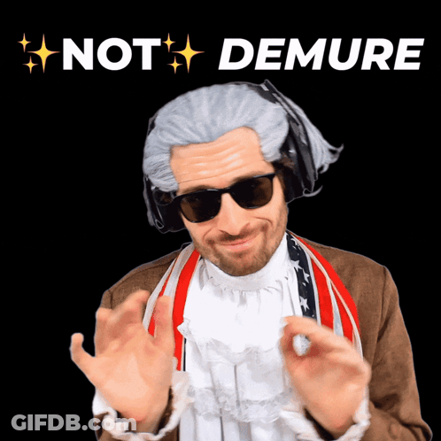 A Man In A Wig And Sunglasses With The Words Not Demure Above Him GIF