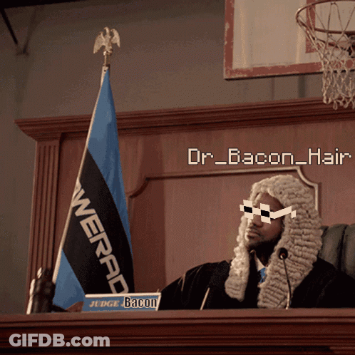 A Man In A Wig Is Sitting At A Podium With A Sign That Says " Judge Bacon " GIF