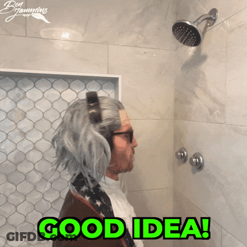 A Man In A Wig Is Taking A Shower With The Words Good Idea Written In Green GIF