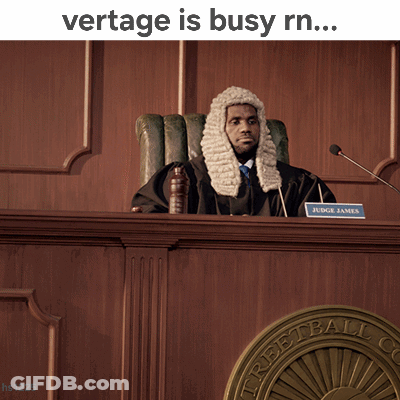 A Man In A Wig Sits In A Courtroom With The Words Vertage Is Busy Rn GIF