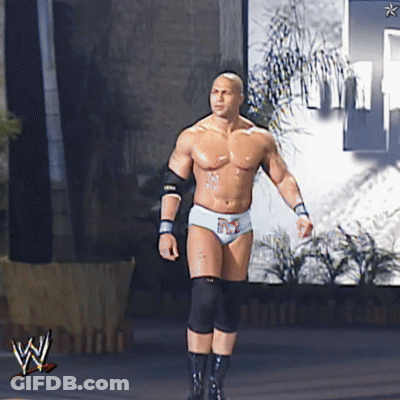 A Man In A Wrestling Outfit Is Walking In Front Of A Wwe Logo GIF