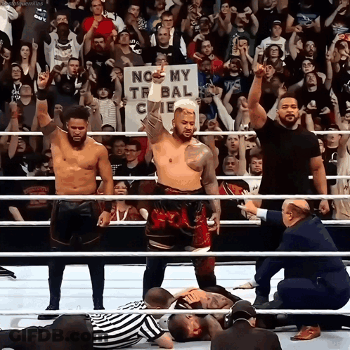 A Man In A Wrestling Ring Holds Up A Sign That Says No My Tribal Cie GIF