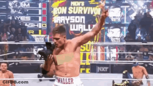 A Man In A Wrestling Ring Is Wearing Shorts That Say Waller On Them GIF