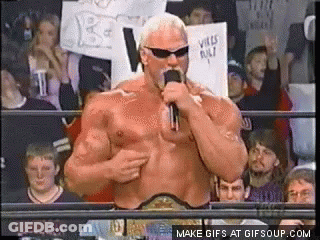 A Man In A Wrestling Ring Talking Into A Microphone GIF
