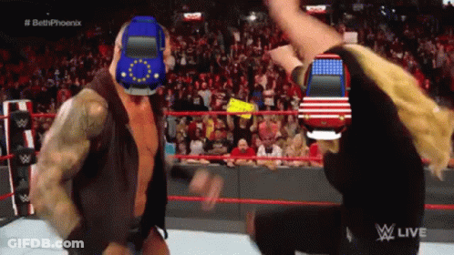 A Man In A Wrestling Ring With A Car On His Head GIF