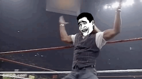 A Man In A Wrestling Ring With A Cartoon Face On His Face . GIF