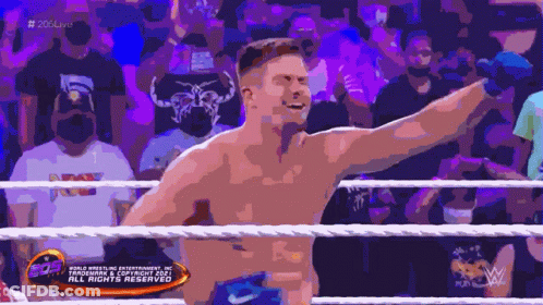 A Man In A Wrestling Ring With A Sign That Says All Rights Reserved On It GIF