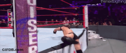 A Man In A Wrestling Ring With A Sign That Says ' The Nextbigthing ' GIF