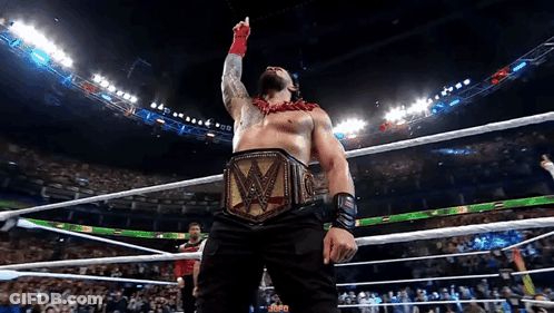 A Man In A Wrestling Ring With A W Belt On GIF