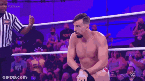 A Man In A Wrestling Ring With A W Logo On The Bottom GIF