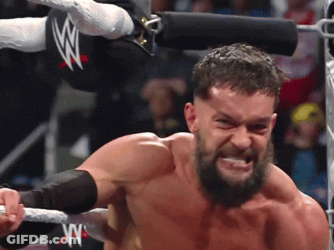 A Man In A Wrestling Ring With A W Logo GIF