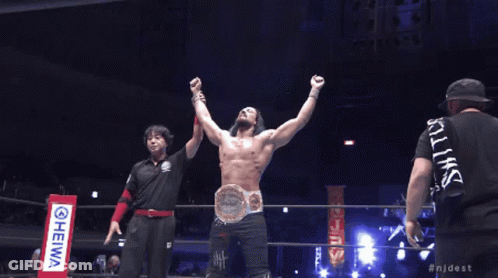 A Man In A Wrestling Ring With His Arms In The Air And The Hashtag Njdest On The Bottom GIF