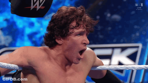 A Man In A Wrestling Ring With His Mouth Open GIF