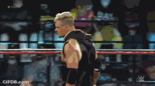 A Man In A Wrestling Ring With The Hashtag # 205Live In The Corner GIF