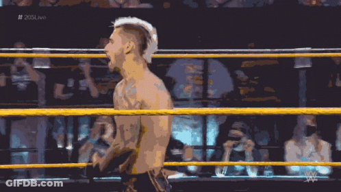 A Man In A Wrestling Ring With The Hashtag # 205Live On The Bottom GIF