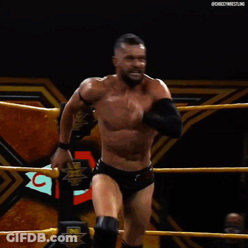 A Man In A Wrestling Ring With The Hashtag Choccywrestling On The Bottom GIF