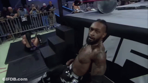 A Man In A Wrestling Ring With The Letter N On His Pants GIF