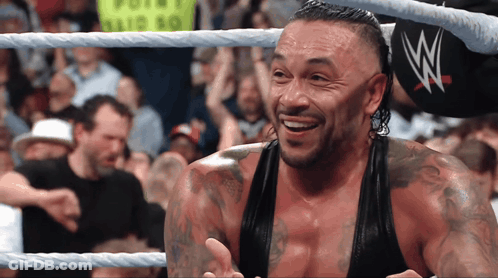 A Man In A Wrestling Ring With The Letter W On His Hat GIF
