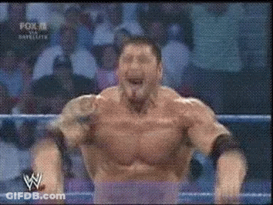 A Man In A Wrestling Ring With The Letter W On The Bottom Right GIF