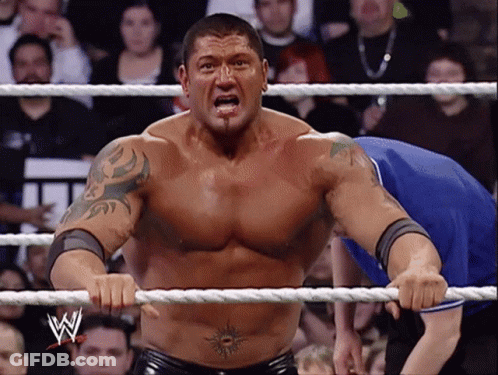A Man In A Wrestling Ring With The Letter W On The Rope GIF