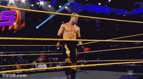 A Man In A Wrestling Ring With The Number 15 In The Back GIF