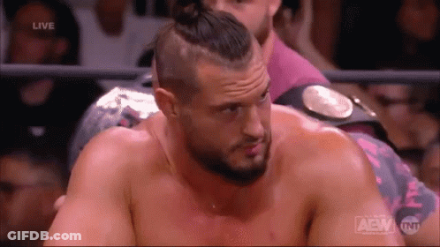 A Man In A Wrestling Ring With The Word Aew On The Bottom Right GIF