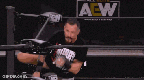 A Man In A Wrestling Ring With The Word All Elite Wrestling Behind Him GIF