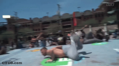 A Man In A Wrestling Ring With The Word Fitc On The Bottom Right GIF