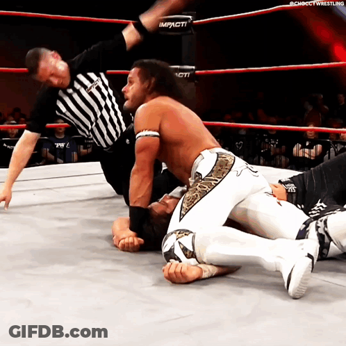 A Man In A Wrestling Ring With The Word Impact On The Side GIF