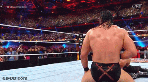 A Man In A Wrestling Ring With The Word Live On The Screen GIF