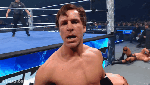 A Man In A Wrestling Ring With The Word Mack On The Side GIF